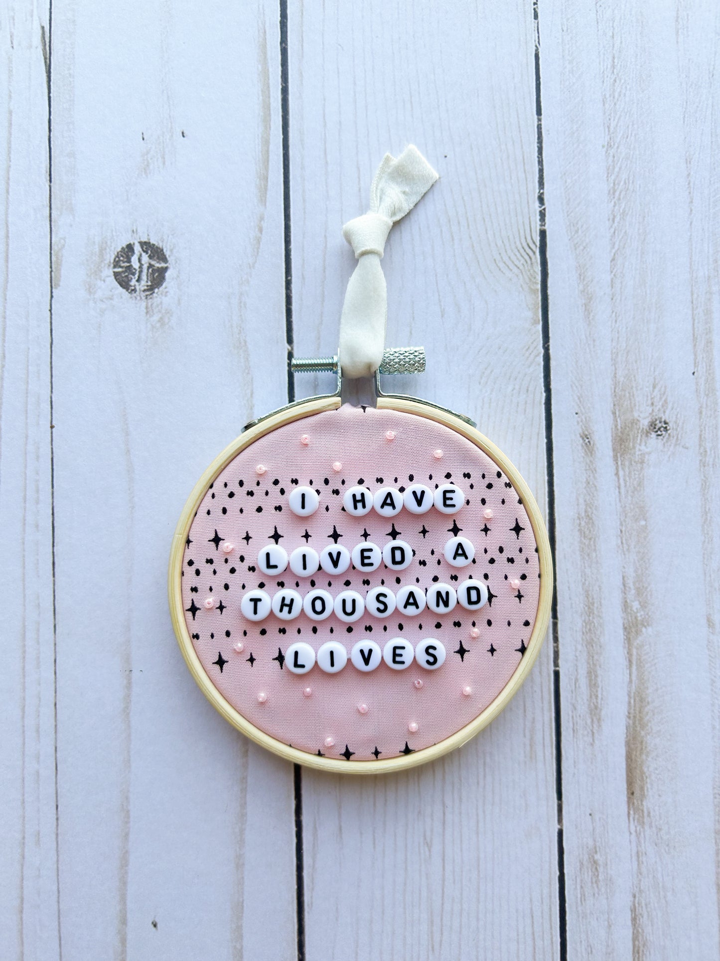 I Have Lived A Thousand Lives Hoop Ornament