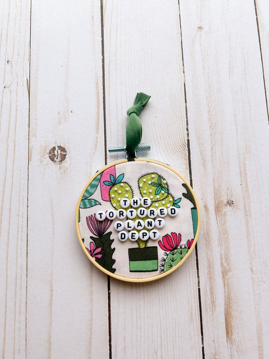 The Tortured Plant Dept Hoop Ornament
