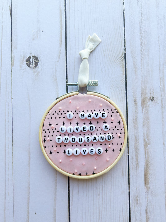 I Have Lived A Thousand Lives Hoop Ornament