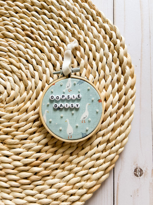 Oopsie Daisy Hoop Ornament